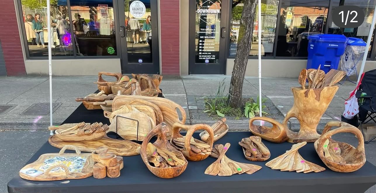 Olive wood pieces laid out at a market table