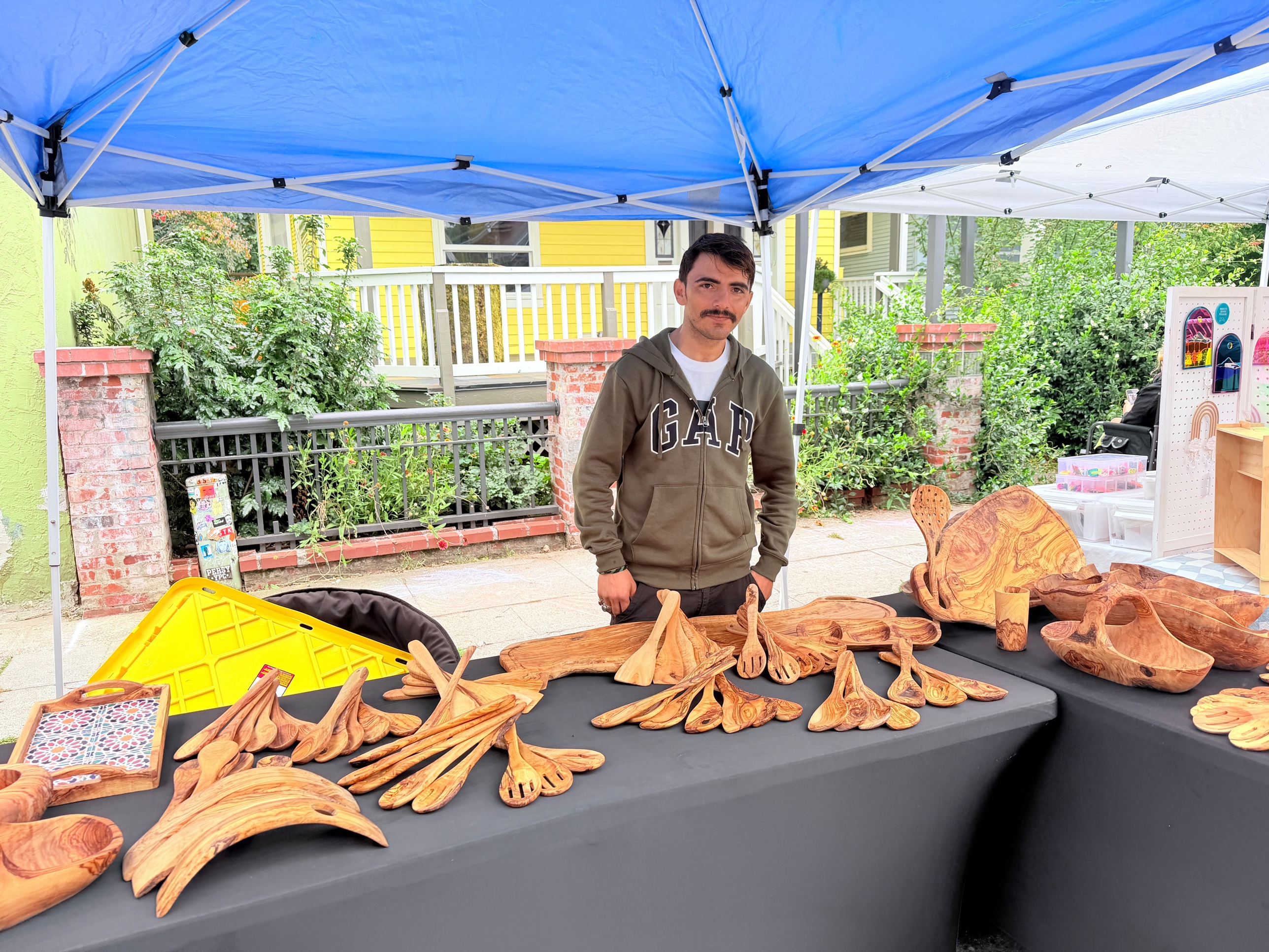 OliveWood at an outdoor market booth
